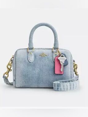Coach Mini Rowan Crossbody Bag
In Loved Denim With Charms